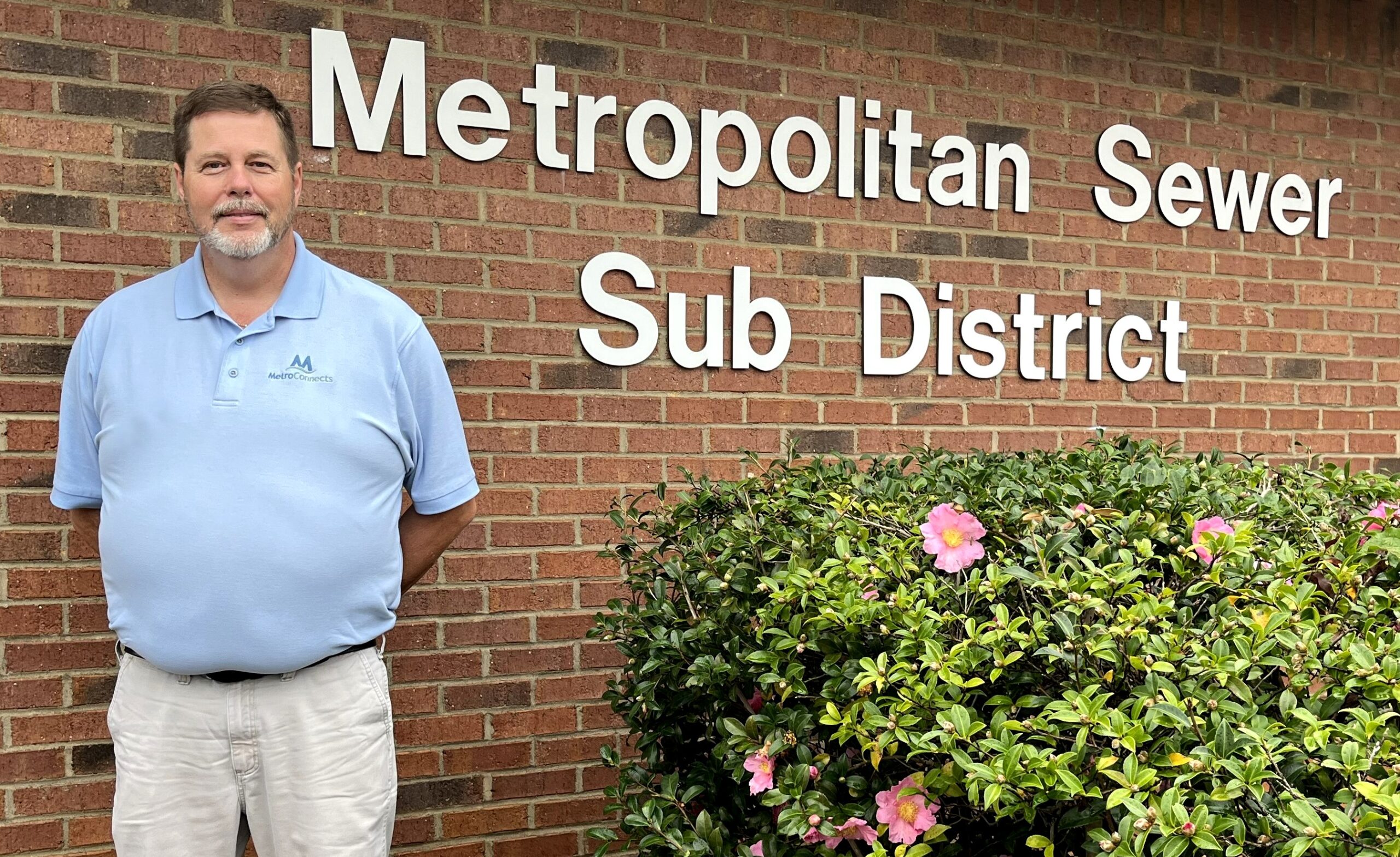Michael Stansell in front of Metro sign
